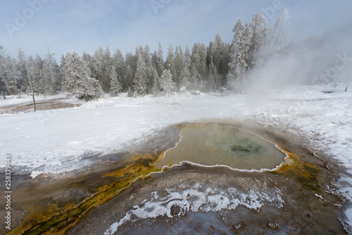 Colorful geyser flow in winter photo