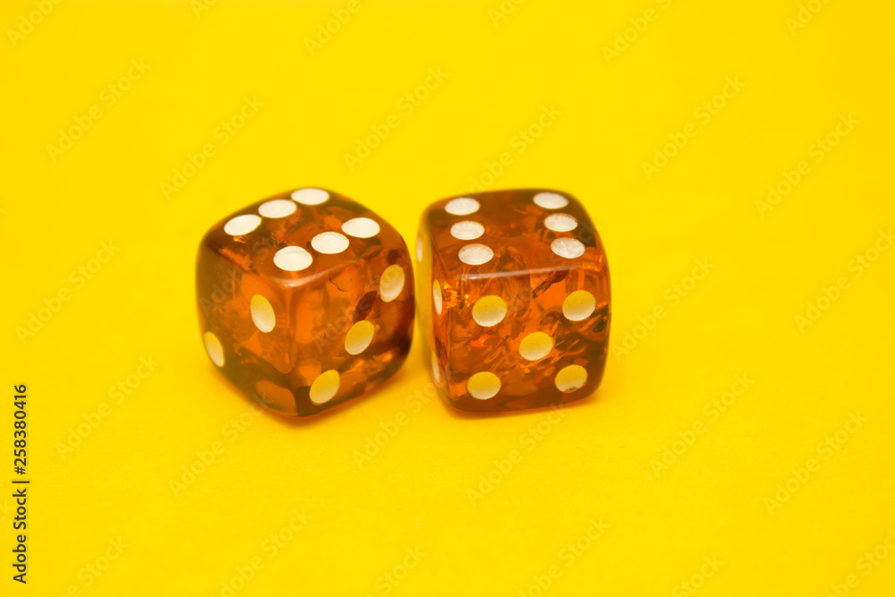 Amber daces close up on yellow background Amber daces close up on yellow background
