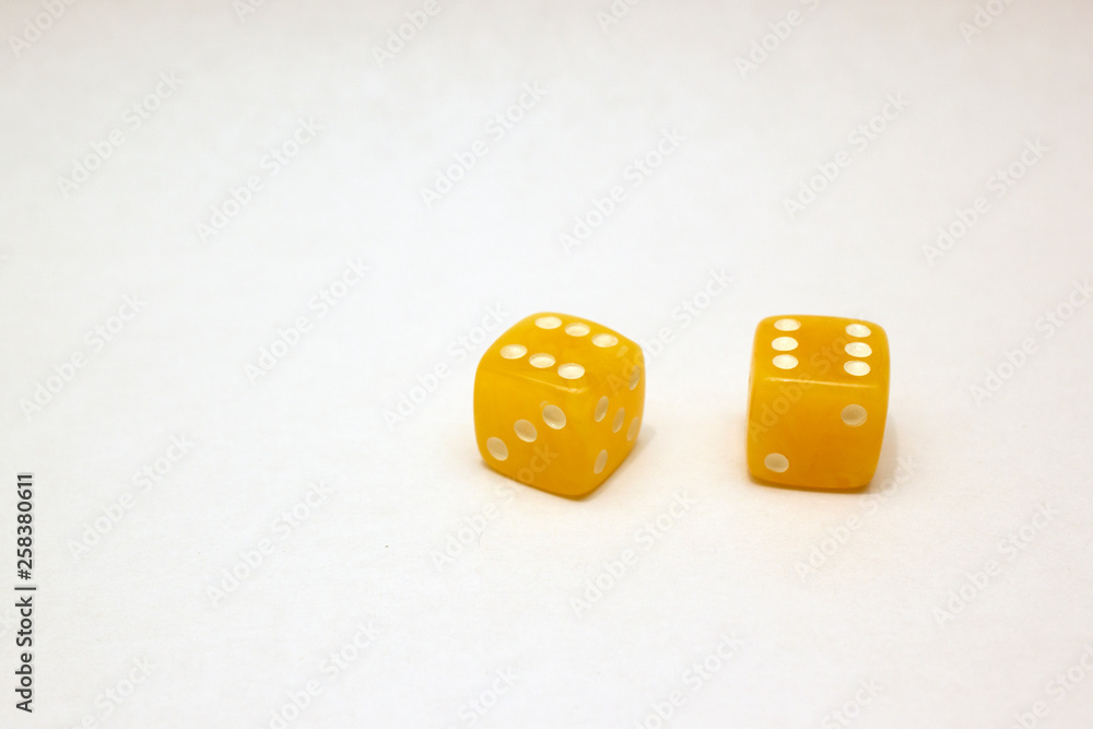 Dices made of light amber on white background isolated Dices made of light amber on white background isolated