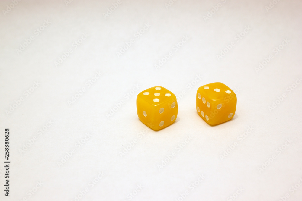 Dices made of light amber on white background isolated Dices made of light amber on white background isolated