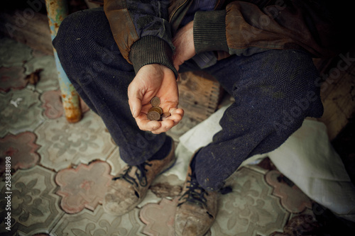 Male hand asks for money. The concept of poverty in the country. photo