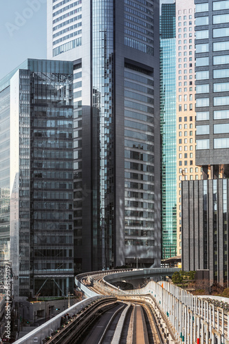 Photography View of modern skyscrapers and Yurikamome rail track in Tokyo, Japan