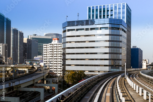 View of modern skyscrapers, highway and Yurikamome rail track in Tokyo, Japan. 