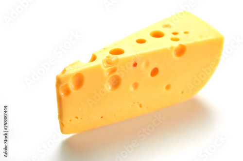 Cheese with big holes on a white background