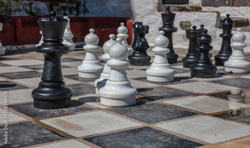 Fototapeta Naklejka Na Ścianę i Meble -  Greece, Kea island. Giant set of chess pieces on Ioulis town street