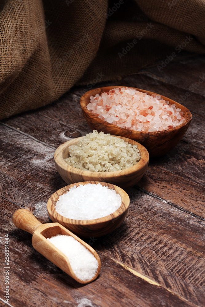 sea salt in bowl. Crystals of salt on table and himalayan salt. sea salt in bowl. Crystals of salt on table and himalayan salt.