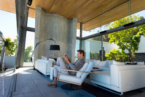 Man phoning in living room