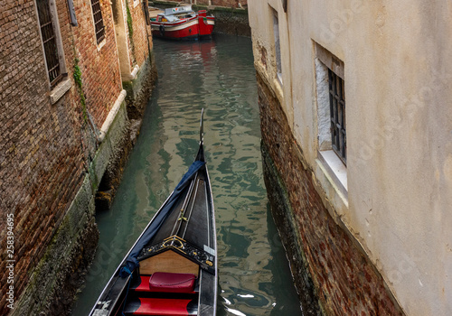 Italy, Venice, view of canals with gondolas carrying visiting tourists. © benny