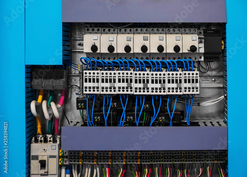 Industrial hvac control cubicle with a lot of electrical equipment.