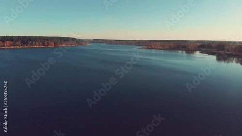 Top view of big river with forest upon the horizon