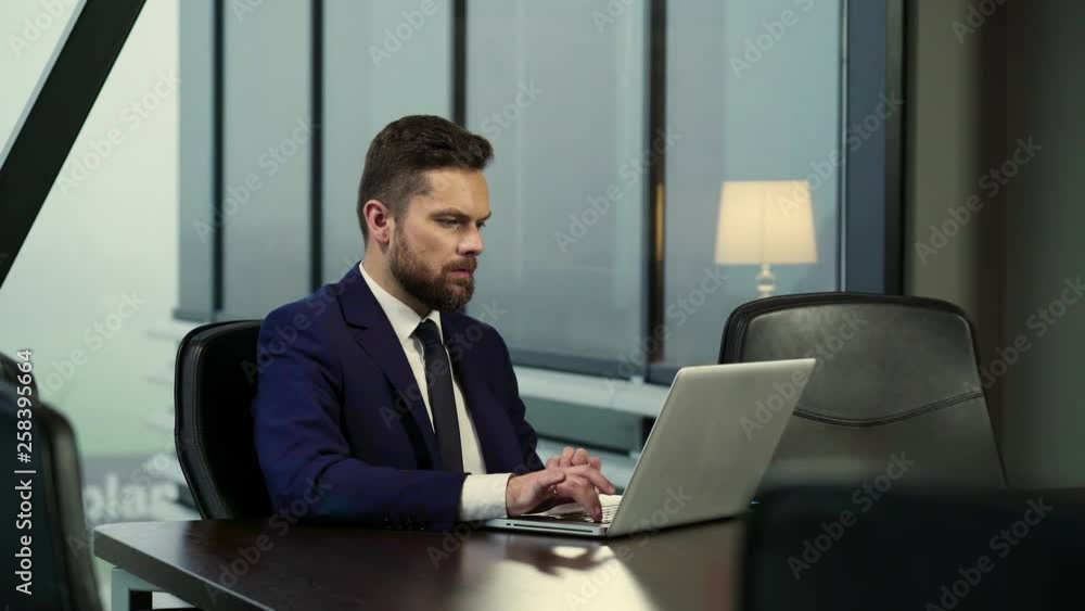 The young director is working in his office. The young director is working in his office.