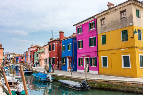 Italy, Venice, Burano, canals and boats among the typical colored houses. © benny