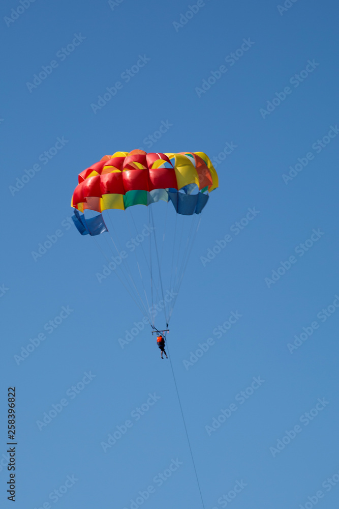 man practicing paragliding sport
