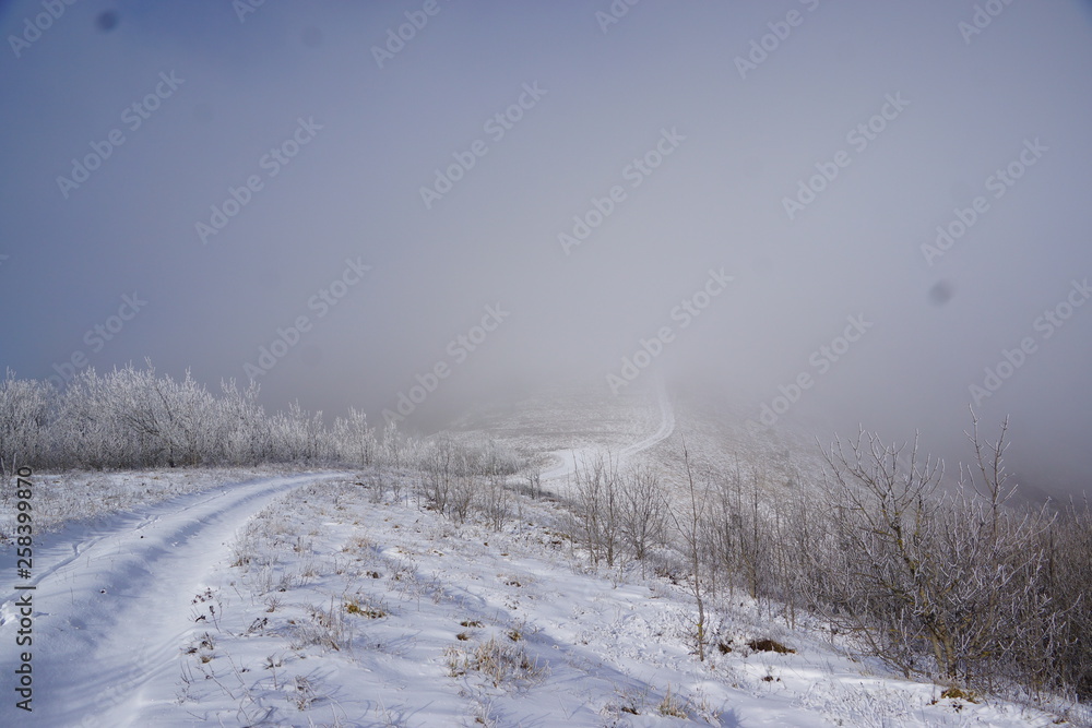 winter landscape with road and clouds winter landscape with road and clouds