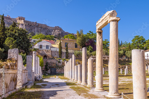 Roman Agora overlooking Acropolis of Athens, Greece. It is an old landmark of Athens. Scenic view of Ancient Greek ruins in the Athens center near Plaka. Remains of the antique Athens city in summer.  photo