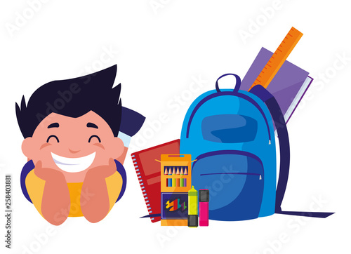 happy little schoolboy with schoolbag and supplies