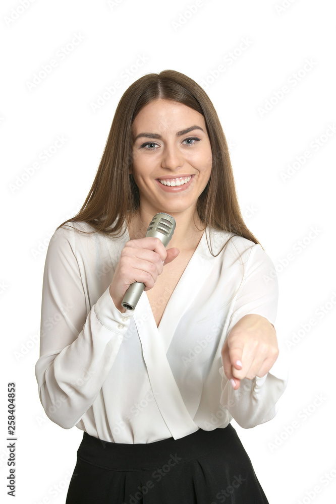 Portrait of happy young woman with microphone isolated on white background Portrait of happy young woman with microphone isolated on white background