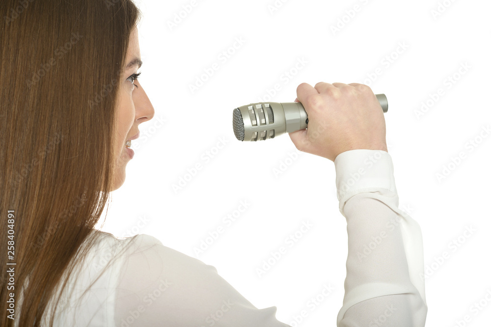 Portrait of young woman with microphone isolated on white background Portrait of young woman with microphone isolated on white background