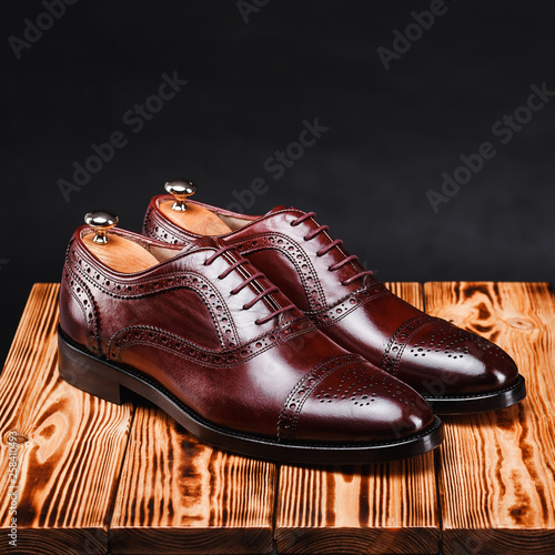 leather stylish men's shoes on a black background