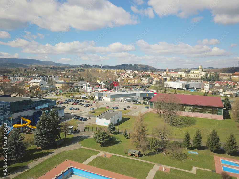 Gorlice, Poland - 3 9 2019: Panorama of a small European medieval city at the present time. View from the drone or quadrocopter on the MOSiR sports complex and the historical center. Landscape Design