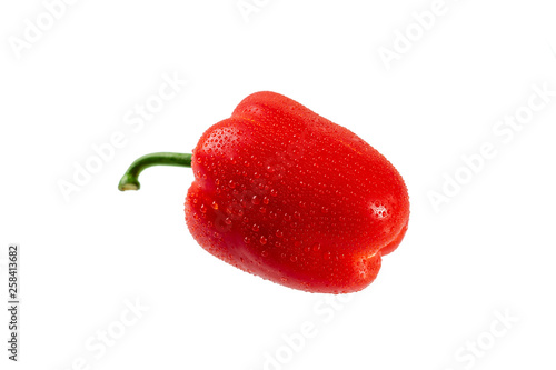 Red bell pepper with water drops isolated on white background