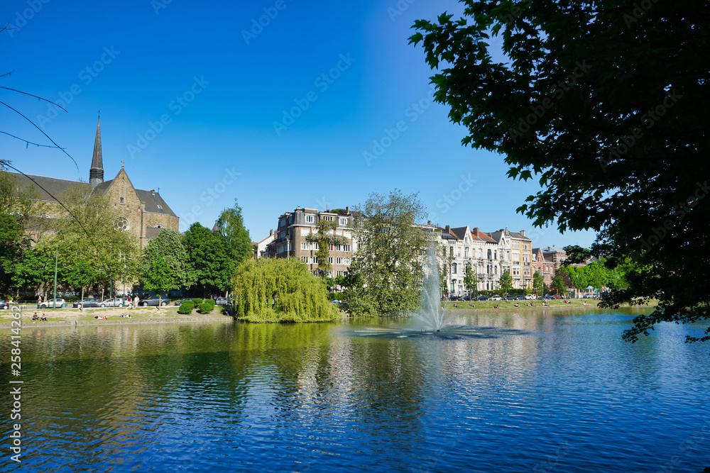 BRUSSELS, BELGIUM - MAY 6, 2018: Lake and trees along the shore, Flagey Avenue