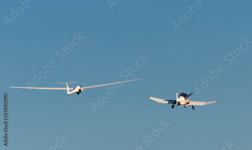 Glider pulled by motor aircraft.