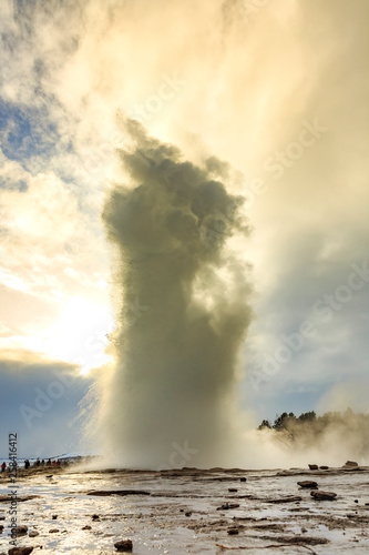 Geyser fountain discharges water at Strokkur Geysir, Iceland located at the golden circle route