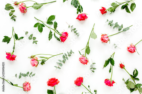 Wallpaper Mural Floral pattern made of red roses and eucalyptus branches on white background. Valentine's background. Floral pattern. Flat lay, top view.  Torontodigital.ca
