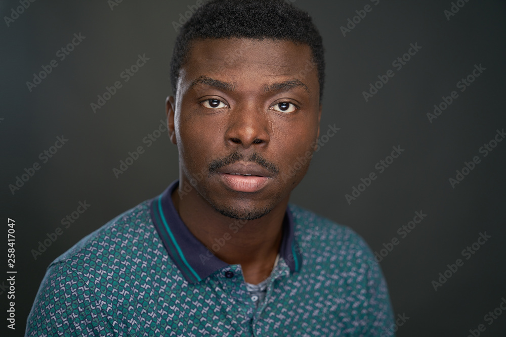 Obraz premium Portrait of black man with green tshirt