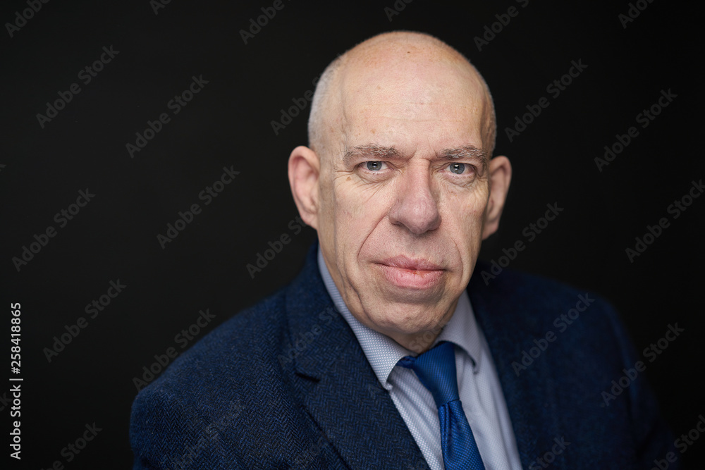 Bald caucasian man with shirt jacket and tie in studio Bald caucasian man with shirt jacket and tie in studio