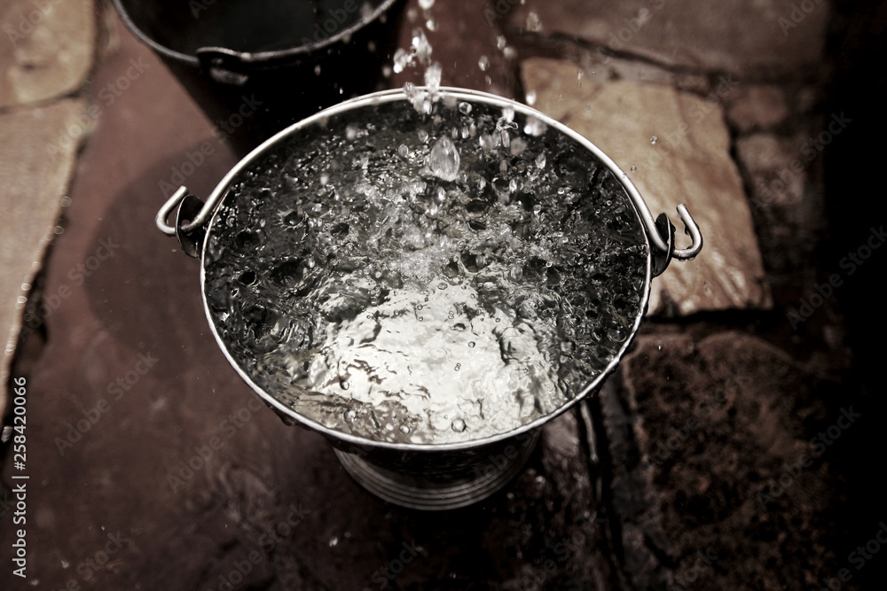 water in bucket from well water in bucket from well