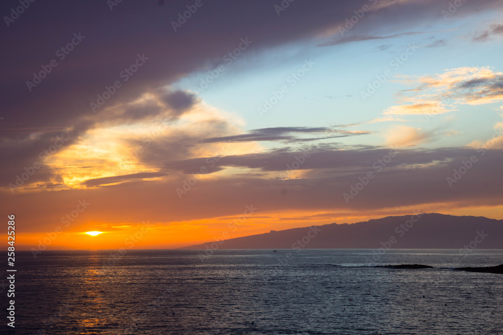 beautiful sunset over the Atlantic ocean at Costa Adaje, Tenerife Island, Spain