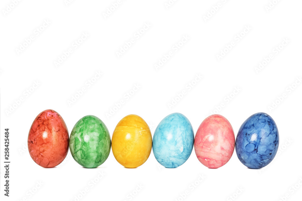 Different decorative Easter eggs in a row isolated on white background Different decorative Easter eggs in a row isolated on white background