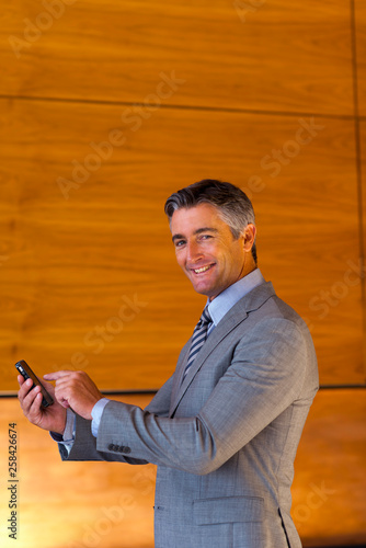 Businessman phoning portrait