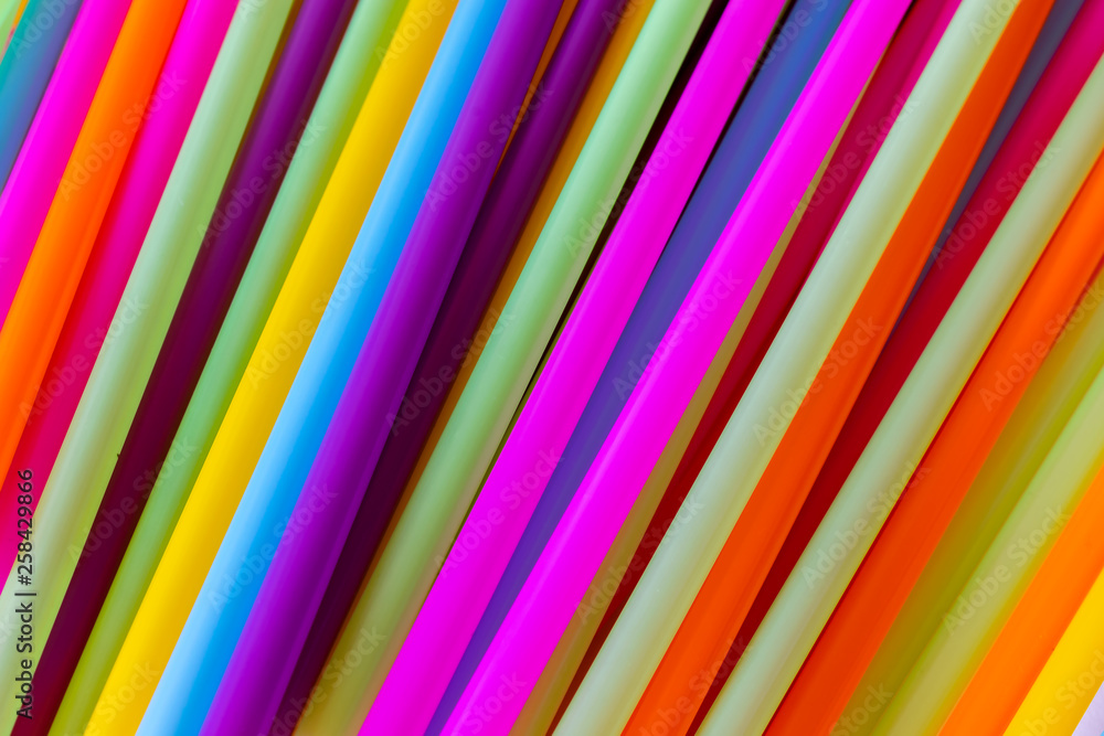 Close up to plenty colorful straws background