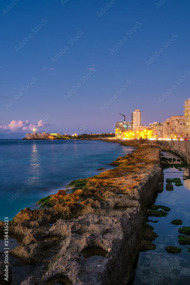 Havana at night - The castle of El Morro and the Havana seaside skyline