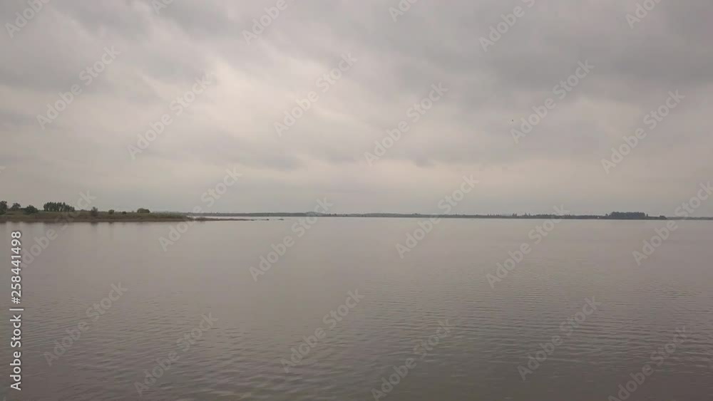 Drone flying low over a calm lake in Prachin Buri Thailand Drone flying low over a calm lake in Prachin Buri Thailand
