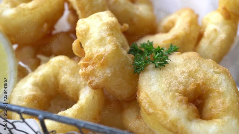 A pan shot of a hot basket of deep fried goodness. A pan shot of a hot basket of deep fried goodness.