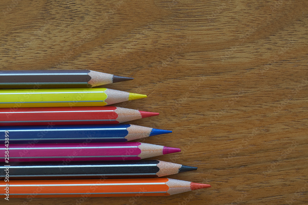 Coloured Pencils Horizontal Alignment on A Wooden Background Coloured Pencils Horizontal Alignment on A Wooden Background