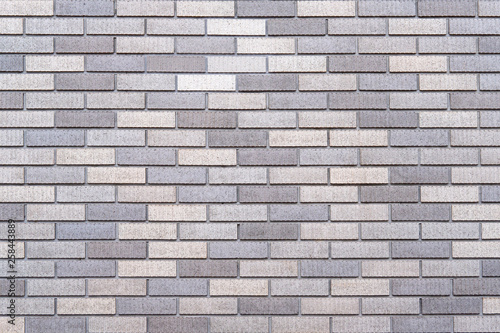 Abstract gray brick wall texture background. Horizontal view of masonry brick wall.