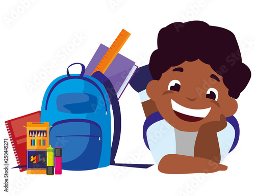 happy little black schoolboy with schoolbag and supplies