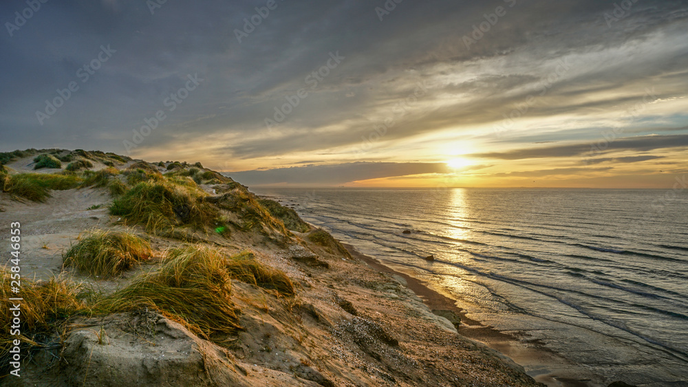 Fototapeta premium Sunset with Clouds Reflections at the South Coast of Brazil during Road Trip in South America