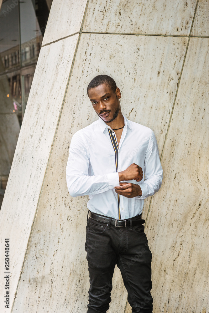 Portrait of Young African American Man in New York City. Young black guy  with beard, wearing