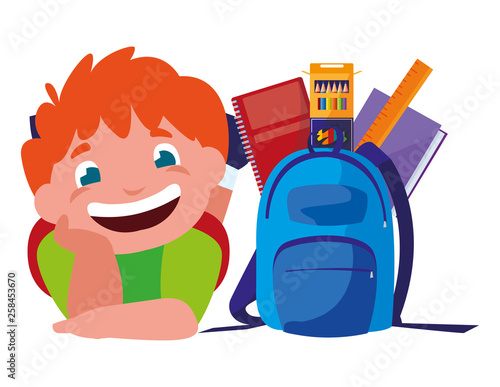 happy little schoolboy with schoolbag and supplies