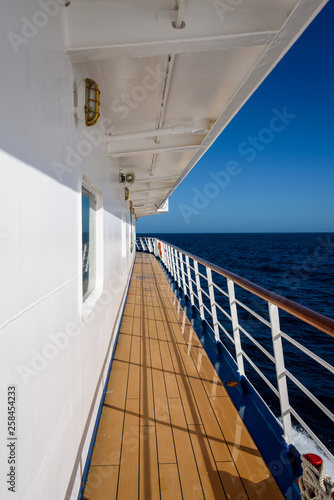 View of blue sky and blue ocean on sunny day from outside deck of cruise ship, Atlantic Ocean © knelson20
