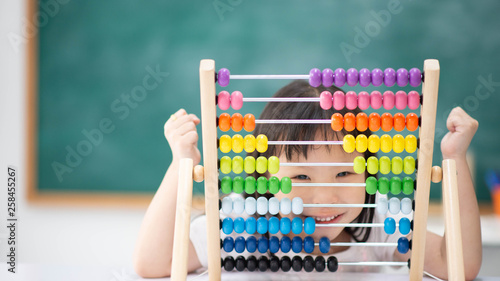 Students boy and girl leaning math in the class room Montessori