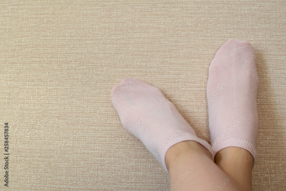 Pink cotton socks on beautiful woman's feet. Pink cotton socks on beautiful woman's feet.