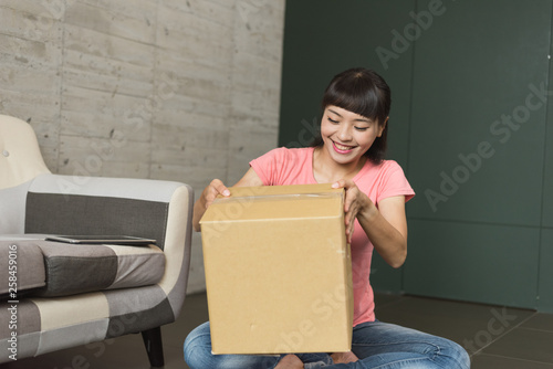 woman unboxing at home