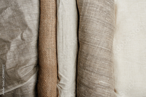 Quadro em tela Natural fabrics from organic colors of flax and cotton in rolls, homespun textile handmade
